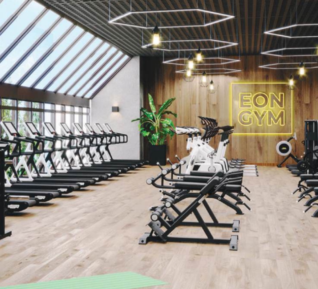 EON Hyderabad — the rooftop gymnasium with treadmills under a skylight