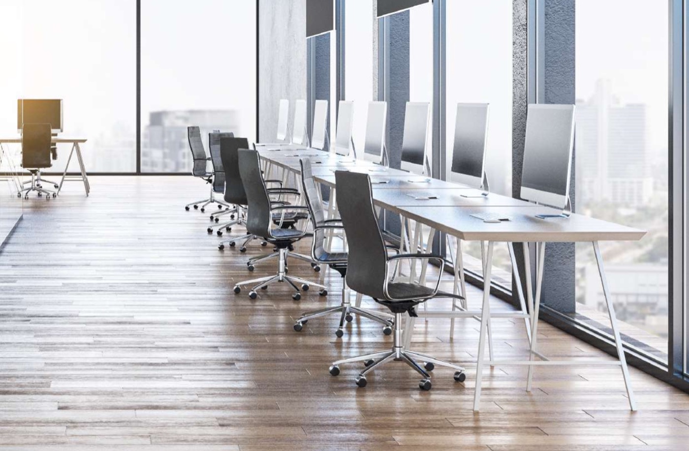 EON Hyderabad — a daylit Grade-A office floor with floor-to-ceiling glass and a city view