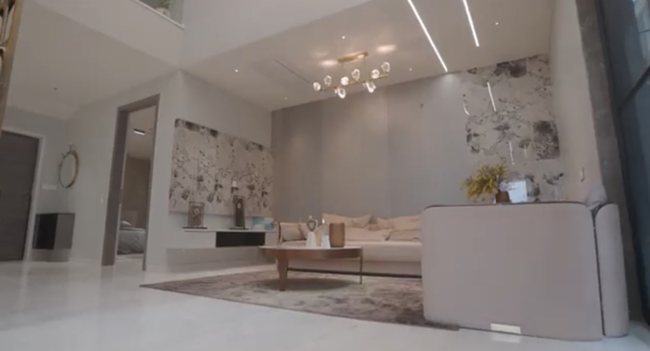 La Casa villa — living room with marble feature wall
