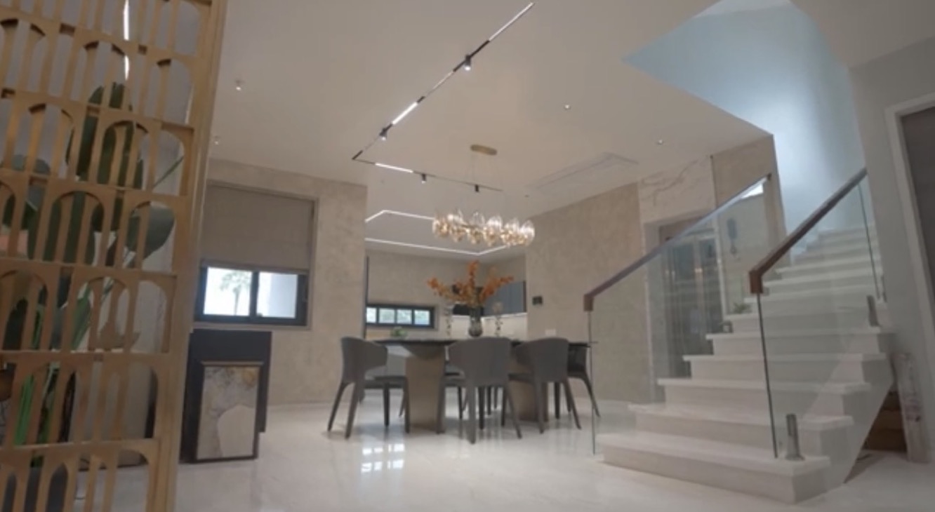 La Casa villa — dining area with feature staircase