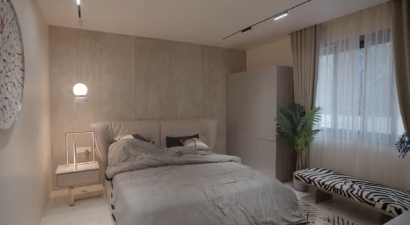 La Casa villa — bedroom with warm finishes