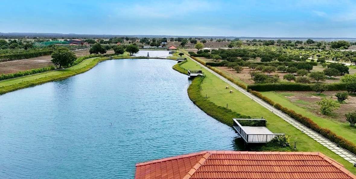 Villaggio — a 175-acre planned, managed farmland community with a crafted lake and orchards near Shankarpalli, Hyderabad